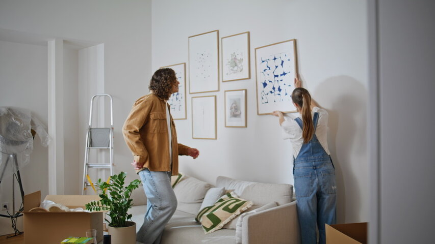 A person and a child a picture on a wall

AI-generated content may be incorrect.